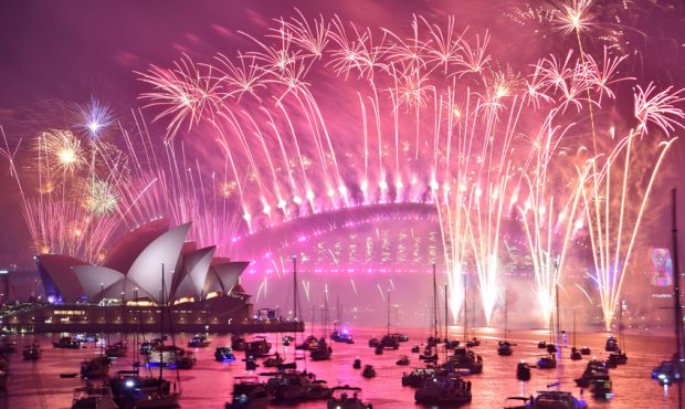 New Year's Eve fireworks erupt over Sydney's iconic Harbour Bridge and Opera House during the firew...