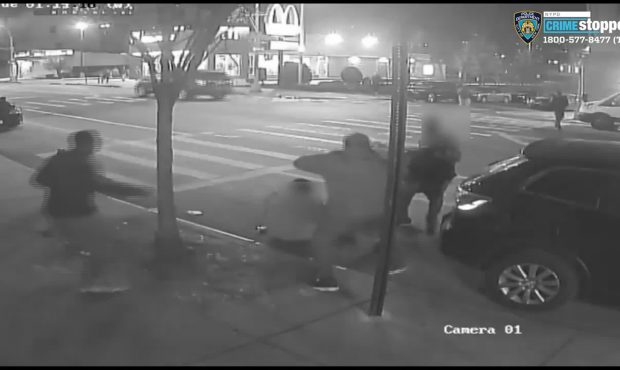 A still image from a surveillance video shows two men being attacked and robbed in the Bronx. (DCPI...