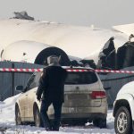 A view of the site of a passenger plane crash outside Almaty on December 27, 2019. - At least 15 people died on December 27, 2019 and dozens were reported injured when a passenger plane carrying 100 people crashed into a house shortly after takeoff from Kazakhstan's largest city. (Photo by Ruslan PRYANIKOV / AFP) (Photo by RUSLAN PRYANIKOV/AFP via Getty Images)