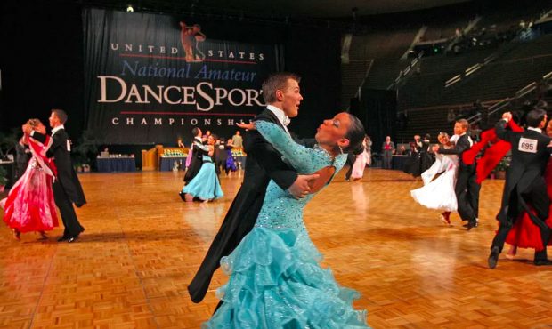 Couples dance in the preliminary rounds as dundreds of ballroom dancers of all ages sweep compete a...