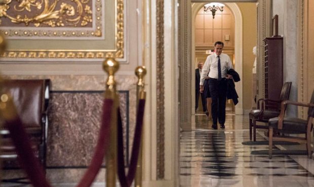 Senator Mitt Romney (R-UT) walks through the U.S. Capitol during a break on the second day that Sen...