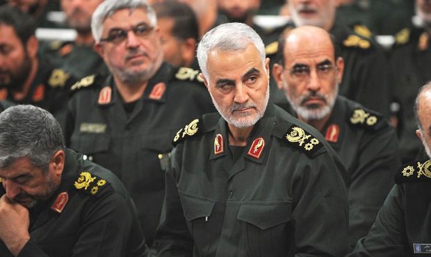 Iranian Quds Force commander Qassem Soleimani (C) attends Iranian supreme leader Ayatollah Ali Kham...