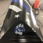 The team at RawTin Garage in Salt Lake City created custom art for the casket of police dog Hondo, who was killed in the line of duty Feb. 13, 2020. (Photo courtesy of RawTin Garage)