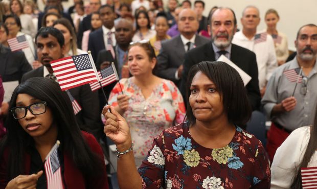 Immigrants become American citizens at a U.S. Citizenship & Immigration Services naturalization cer...