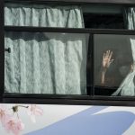 A man waves from a bus carrying passengers who disembarked the quarantined Diamond Princess cruise ship as he leaves the Daikoku Pier on February 19, 2020 in Yokohama, Japan. About 500 passengers who have tested negative for the coronavirus (COVID-19) were allowed to disembark the cruise ship on Wednesday after 14 days quarantine period as at least 542 passengers and crew onboard have tested positive for the coronavirus. Including cases onboard the ship, 615 people in Japan have now been diagnosed with COVID-19 making it the worst affected country outside of China.  (Photo by Tomohiro Ohsumi/Getty Images)