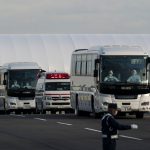 Buses carrying passengers who disembarked the quarantined Diamond Princess cruise ship and emergency vehicle drive at the Daikoku Pier on February 19, 2020 in Yokohama, Japan. About 500 passengers who have tested negative for the coronavirus (COVID-19) were allowed to disembark the cruise ship on Wednesday after 14 days quarantine period as at least 542 passengers and crew onboard have tested positive for the coronavirus. Including cases onboard the ship, 615 people in Japan have now been diagnosed with COVID-19 making it the worst affected country outside of China.  (Photo by Tomohiro Ohsumi/Getty Images)