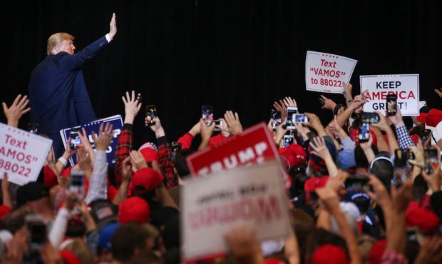 President Donald Trump waves to the crowd as he departs a campaign rally at Las Vegas Convention Ce...