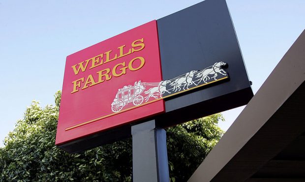 FILE: The Wells Fargo logo is seen on a sign outside of a Wells Fargo Home Mortgage branch office i...