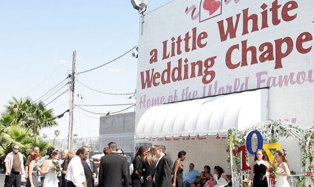 FILE: Wedding parties gather at the Little White Wedding Chapel in Las Vegas, Nevada. (Photo by Eth...
