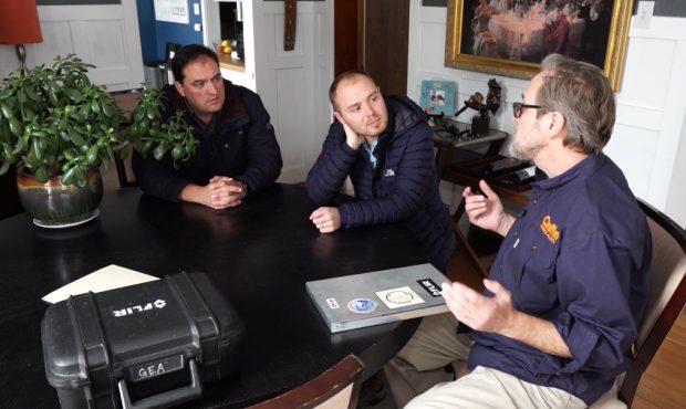 Thomas Camoin of Griffin Energy Audits explains to Matt Gephardt and homeowner Mike Berger the bene...