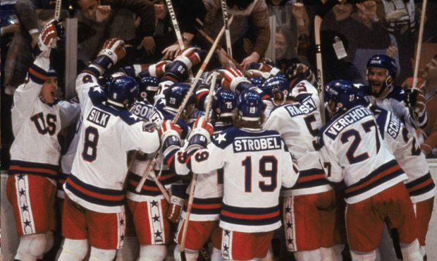 Team USA celebrates their 4-3 victory over the Soviet Union in the semi-final Men's Ice Hockey even...