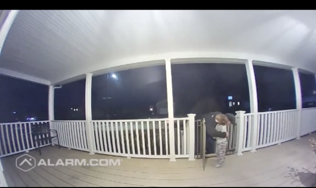 A young boy runs up and hugs a man delivering pizza and it was captured on a doorbell camera. (WLNE...