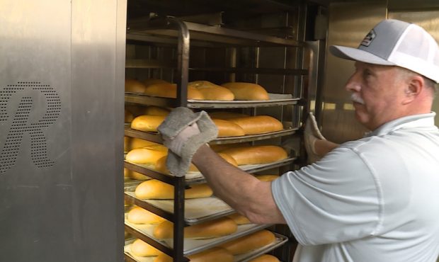 Steve Borg pulls a rack of fresh bread from the oven at Schmidt's Pastry College in South Jordan....