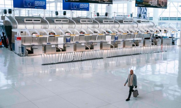 A man walks past the closed Air France counters at the Terminal 1 section at John F. Kennedy Intern...