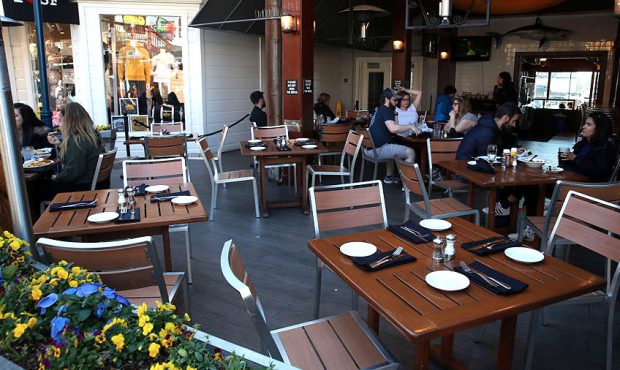 Tables sit empty at a restaurant on San Francisco's popular Pier 39 tourist destination on March 12...