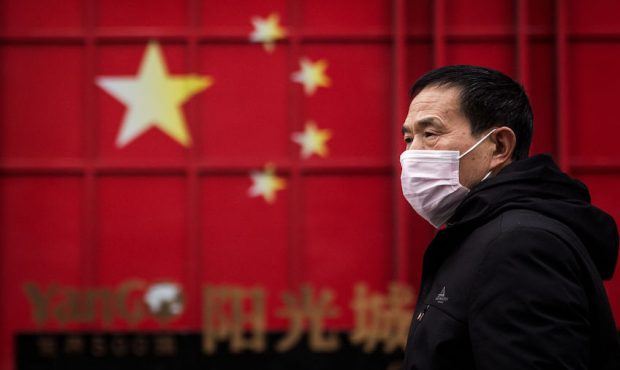 A man wears a protective mask on February 10, 2020 in Wuhan, China. Flights, trains and public tran...