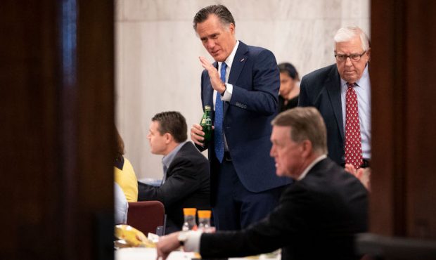 Sen. Mitt Romney (R-UT) speaks as he attends a Senate GOP lunch meeting in the Russell Senate Offic...