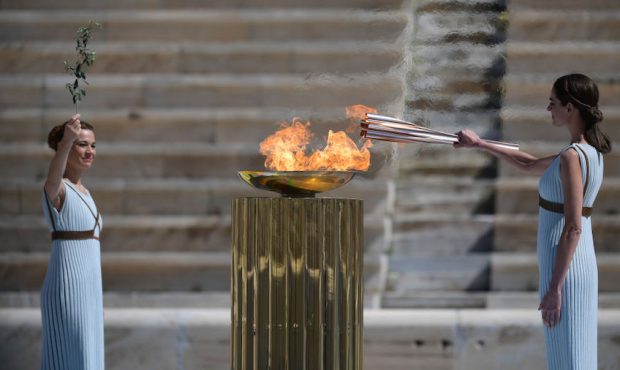 Greek actress Xanthi Georgiou dressed as an ancient Greek high priestess lights the olympic torch d...