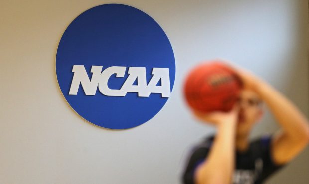 BALTIMORE, MARYLAND - MARCH 06: The NCAA logo is seen on the wall as Yeshiva players warmup prior t...