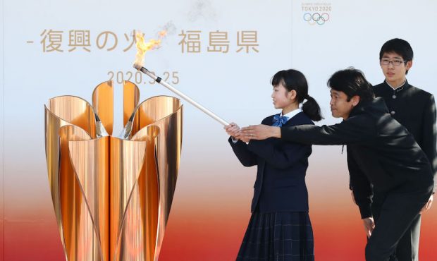 IWAKI, JAPAN - MARCH 25: The Olympic flame is lit at the cauldron during the 'Flame of Recovery' sp...