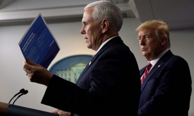 U.S. Vice President Mike Pence speaks as President Donald Trump listens during a news briefing on t...