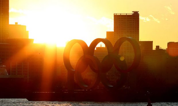 The sun sets behind the Olympic rings in Odaiba marine park on March 24, 2020 in Tokyo, Japan. (Pho...