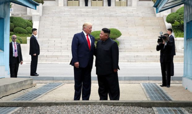 A handout photo provided by Dong-A Ilbo of North Korean leader Kim Jong Un and U.S. President Donal...