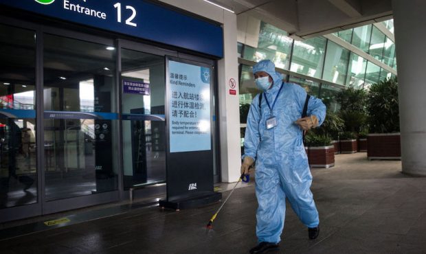Staff disinfect areas at Tianhe airport on 17 march,2020 in Wuhan.Hubei.China. the first batch of m...