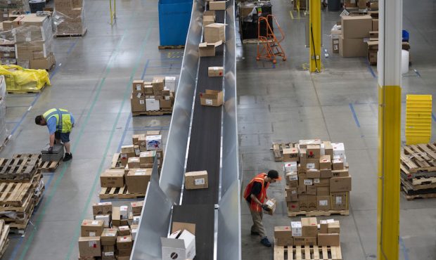 Employees work inside the Amazon.com Inc. fulfillment center in Baltimore, Maryland, U.S., on Tuesd...