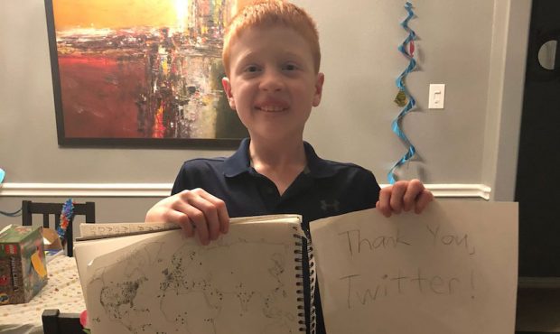 12-year-old Brandon Smith and his map after Twitter users from all over the world responded with th...