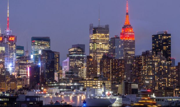The USNS Comfort navy hospital ship is docked at Pier 90 as The Empire State Building Glows Red In ...