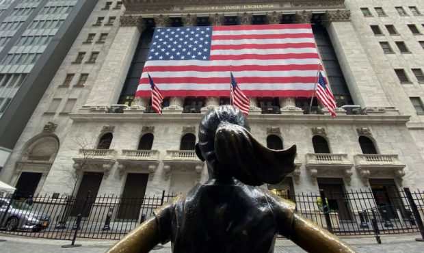 Flags fly at full staff outside the NYSE on April 09, 2020 in New York City. (Photo by Kena Betancu...