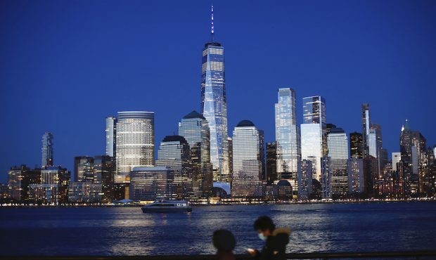 One World Trade Center is lit in blue on April 9, 2020 as seen from Jersey City, New Jersey. Landma...