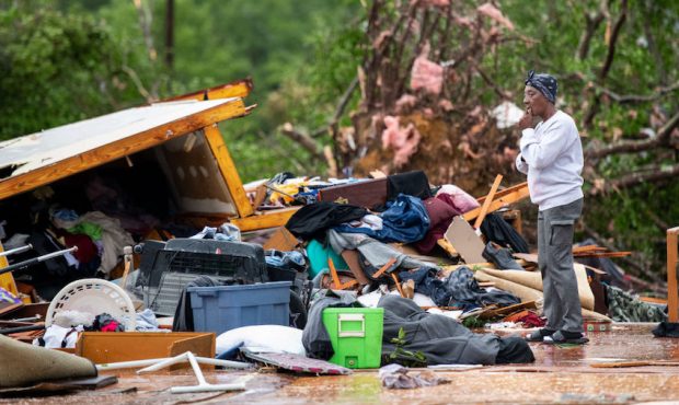 Sylvia Salley looks at the remains of her sisters storm damaged home April 13, 2020 in Livingston, ...