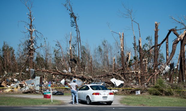 NIXVILLE, SC - APRIL 13: A woman looks at a home leveled by a tornado on April 13, 2020 near Nixvil...
