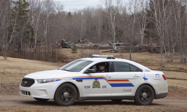 WENTWORTH CENTRE - APRIL 20: An RCMP vehicle is seen parked in front of the rubble of a destroyed h...
