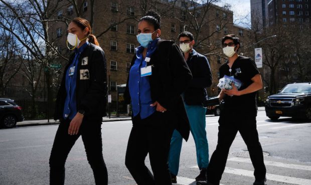Medical workers walk outside of Mount Sinai Hospital amid the coronavirus pandemic on April 01, 202...