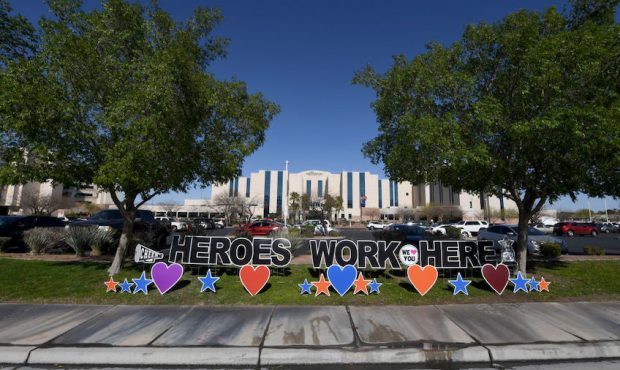 A sign reading "Heroes work here" is shown outside MountainView Hospital during the continuing spre...