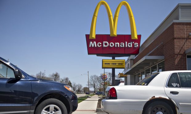 Customers wait in line at the drive-thru outside a McDonald's Corp. restaurant in Ottawa, Illinois,...