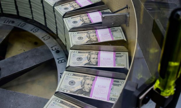 Packs of freshly printed 20 USD notes are processed for bundling and packaging at the US Treasury's...