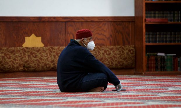 Adnan Ell Kadri listens to prayers in a nearly empty room at Masjid Al-Salaam on the first full day...