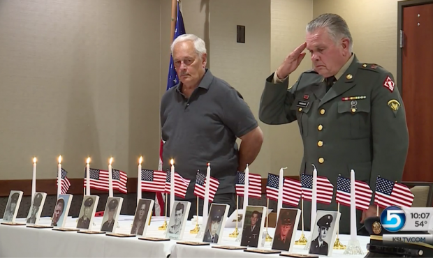 Harold Woodward salutes as members of the U.S. Army 34 Engineer Battalion remember those who gave t...