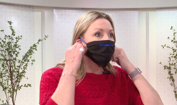 Robin Heiden demonstrates how to properly put on and remove a face mask....