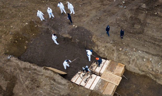 Drone pictures show bodies being buried on New York's Hart Island where the department of correctio...