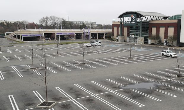 Dick's Sporting Goods store is shown with an empty parking lot amid the coronavirus pandemic at the...