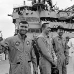 S70-35606 (17 April 1970) --- Rear Admiral Donald C. Davis, Commanding Officer of Task Force 130, the Pacific Recovery Forces for the Manned Spacecraft Missions, welcomes the Apollo 13 crewmembers aboard the USS Iwo Jima, prime recovery ship for the Apollo 13 mission. The crewmembers (from the left) astronauts Fred W. Haise Jr. (waving), lunar module pilot; John L. Swigert Jr., command module pilot; and James A. Lovell Jr., commander; were transported by helicopter to the ship following a smooth splashdown only about four miles from the USS Iwo Jima. Splashdown occurred at 12:07:44 p.m. (CST), April 17, 1970, to conclude safely a perilous space flight.