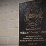 A plaque hanging near the front door of the department was put up by Battalion Chief Eric Sloan in remembrance of Assistant Chief George Plant.