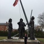 A photo taken by Captain Lyndsie Hauck shows her standing by a statue in Maryland.