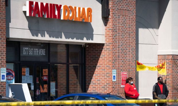 Employees stand outside of the Family Dollar as police investigate a crime scene on Friday, May 1, ...