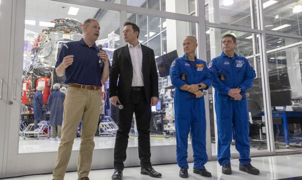 HAWTHORNE, CA - OCTOBER 10: NASA Administrator Jim Bridenstine (L) and SpaceX CEO Elon Musk talk to...